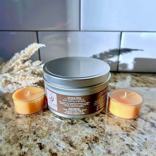 Hand-poured Autumn Glow luxury candle with amber, warm spices, and sandalwood in a minimalist tin