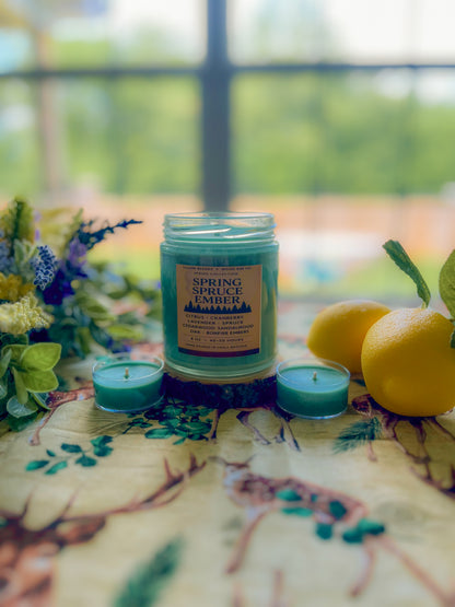 Hand-poured Spring Spruce Ember collaboration candle with citrus, spruce, lavender, and smoky embers
