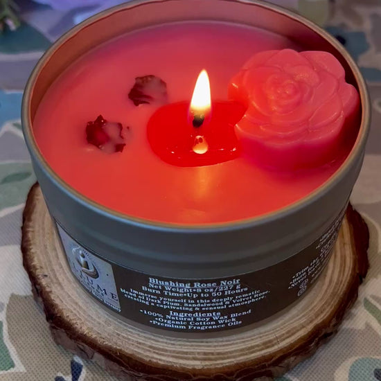 Video showing Blushing Rose Noir candle burning, highlighting rose wax embed and romantic red flame