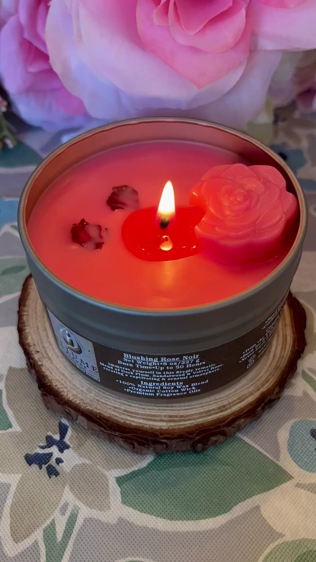 Video showing Blushing Rose Noir candle burning, highlighting rose wax embed and romantic red flame