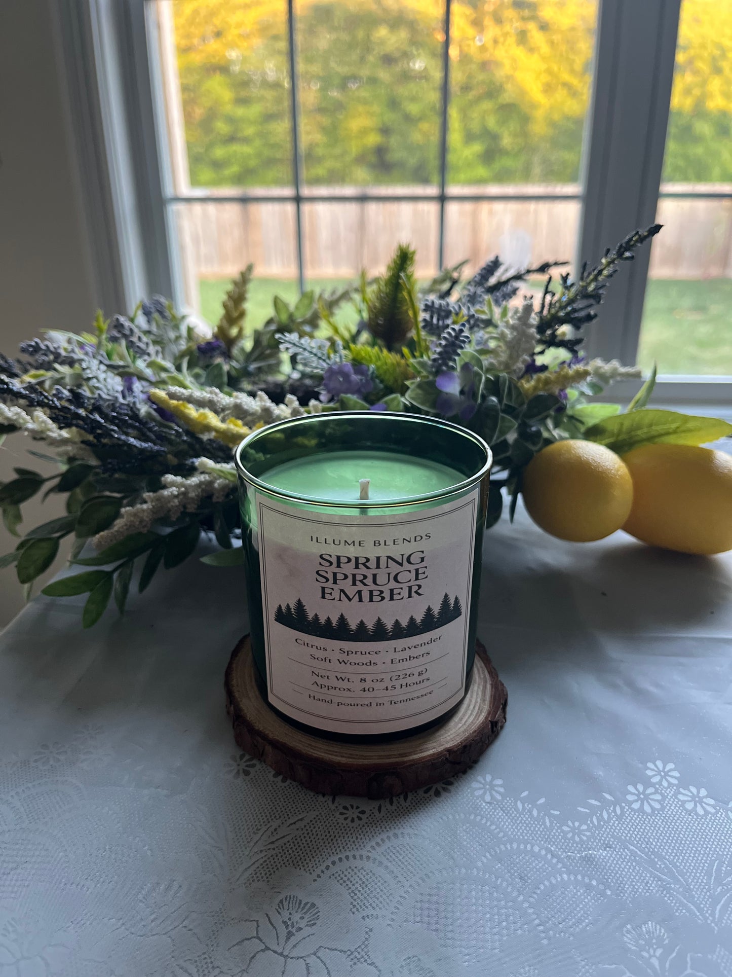 Spring Spruce Ember candle with green wax and minimalist luxury label.