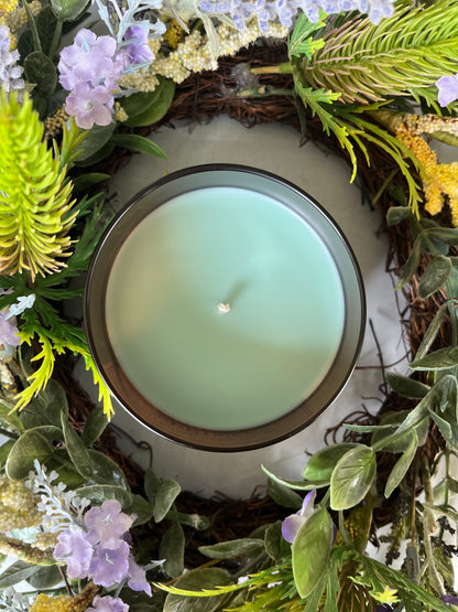 Top view of Spring Spruce Ember candle with soft green wax and centered wick.